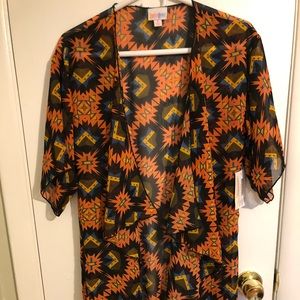 Lularoe Monroe fits 0-12 adults. New with tags